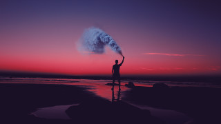 Man beach smoke bomb sunset - dawn free wallpaper