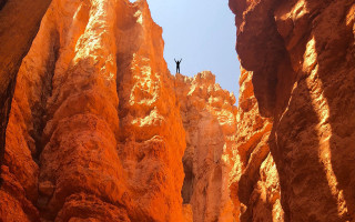 Cliff canyon orange rocks blue - liminal space free wallpaper