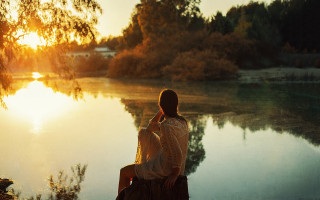 Man sitting lake sunset autumn - a rock next free wallpaper
