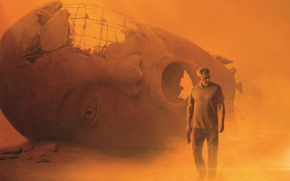 Giant human head yellow smoke - imax 70 mm footage free wallpaper