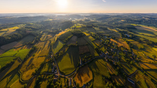 Rural countryside plane window sunset - a plane window free wallpaper