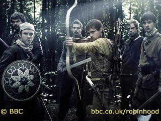 Men holding bows and arrows - a group of men free wallpaper