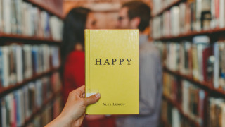 Library holding book blurry background - dave allsop free wallpaper