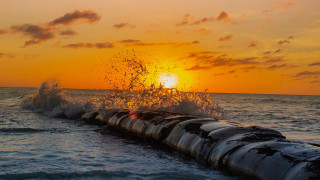 Large pipe ocean sunset water - sunrise free wallpaper