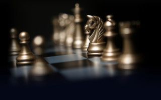 Chess golden piece black background 2 - a chess board free wallpaper