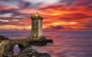 Lighthouse rock wall sunset clouds - thierry doizon free wallpaper