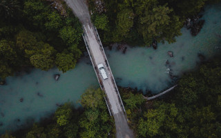 Road trees water car bridge - aerial free wallpaper