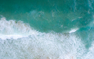 Wave crashing beach surfer night - the water below free wallpaper