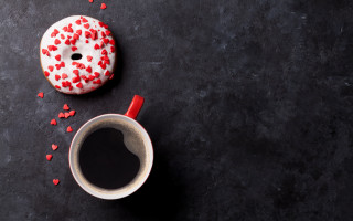 Coffee donut red sprinkles black - a black surface free wallpaper for desktop