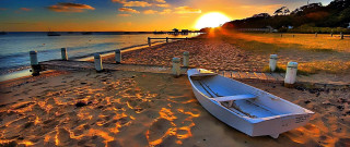 Boat sand water sunset dock - sunrise time free wallpaper