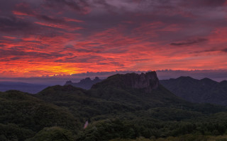 Sunset mountain range red sky 6 - a few tree below free wallpaper