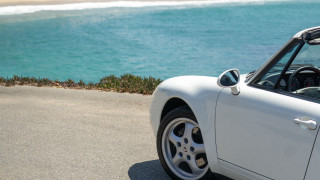 White sports car ocean beach - a white sports car free wallpaper