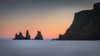 Beach rocks ocean sunset mountain - a group of rocks free wallpaper