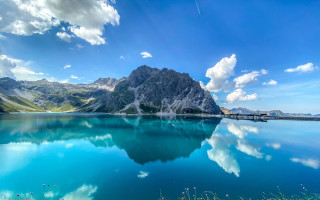Mountain reflection lake beach sky - blue water free wallpaper