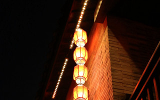 Building lit lamp night dark - a dark sky in the background free wallpaper for desktop