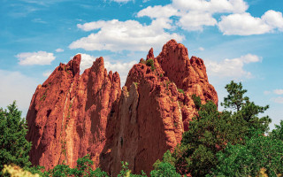 Large rock formation forest blue - saturated free wallpaper