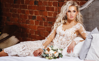 Woman white dress flower brick - her hand and a brick wall behind her free wallpaper
