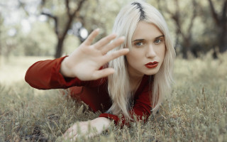 Woman grass outstretched hands portrait - her side free wallpaper