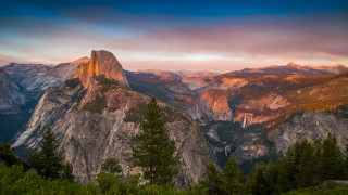 Mountain range sunset clouds forest 3 - tree below free wallpaper