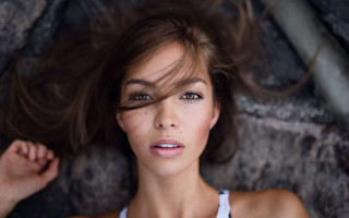 Woman laying rock blurry background - annabel eyres free wallpaper for desktop