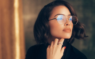 Woman glasses ring black jacket - a gold background free wallpaper