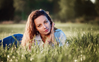 Woman laying in grass serious - anna maria barbara abesch free wallpaper