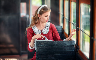 Woman looking window train suitcase - a suitcase in front free wallpaper