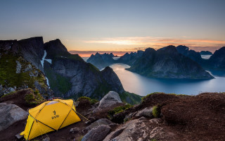 Yellow tent rocky hill sunset - free summer wallpaper