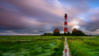 Lighthouse grassy island path person - a lighthouse free wallpaper