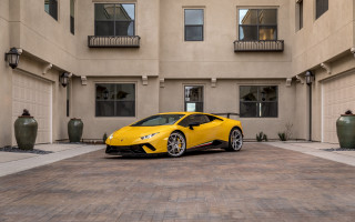 Yellow sports car building large - side profile free wallpaper