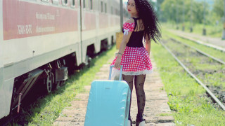 Woman suitcase train track kitsch - a suitcase free wallpaper