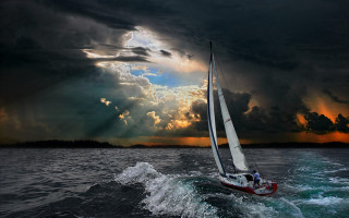 Sailboat ocean cloudy sky sunbeams 2 - sunbeam free wallpaper
