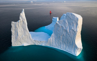 Iceberg ocean red boat mountain - an iceberg free wallpaper
