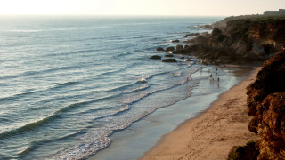 Beach cliff waves people sunset - a cliff and a body of water free wallpaper for desktop