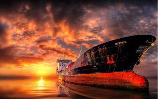 Large boat water sunset cloudy - water under a cloudy sky free wallpaper