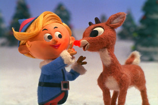 Little girl kissing rudolph reindeer - the movie free wallpaper