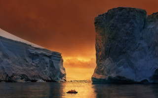 Iceberg sunset boat mountain ocean - a boat free wallpaper for desktop