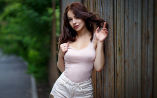 Woman fence blowing hair model - leaning free wallpaper