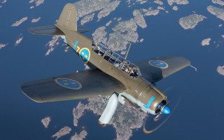 Small plane flying over water - dieselpunk free wallpaper