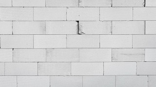 White brick wall crack clock - a white brick wall free wallpaper