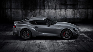 Silver sports car dark room 7 - a concrete wall behind free wallpaper