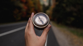 Person compass road forest blurry - a compass free wallpaper