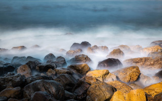 Rocky beach foreground water horizon - the foreground and a body of water free wallpaper