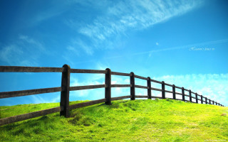Wooden fence grassy hill mountain - blunt border free wallpaper