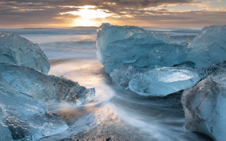 Icebergs sunset ocean clouds beach - a group of icebergs free wallpaper