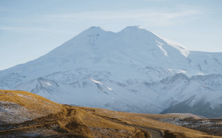 Snowy mountain road trees tiltshift - free winter wallpaper