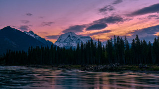 Mountain river forest sunset cityscape - the foreground and a sunset in the background free wallpaper
