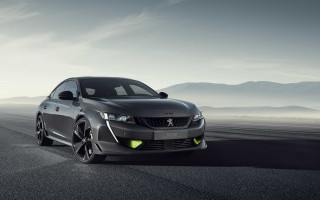 Grey car mountains clouds road - a grey car free wallpaper