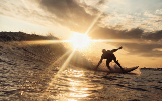 Surfing sunset ocean lens flare - in the ocean free wallpaper
