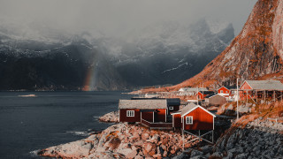 Small village rocky shore rainbow - free winter wallpaper